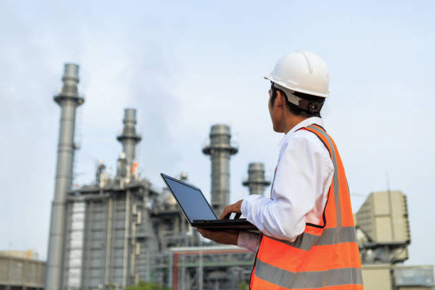 image of engineer holding a laptop